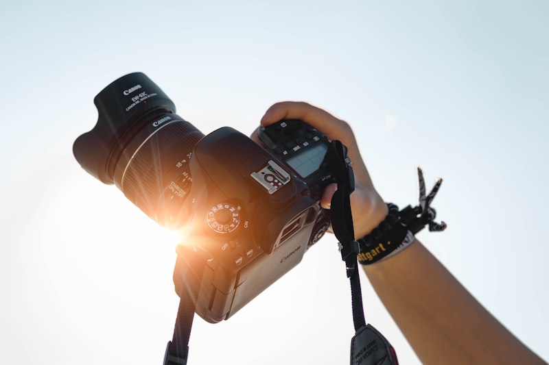 LensMan photographer at work with camera equipment